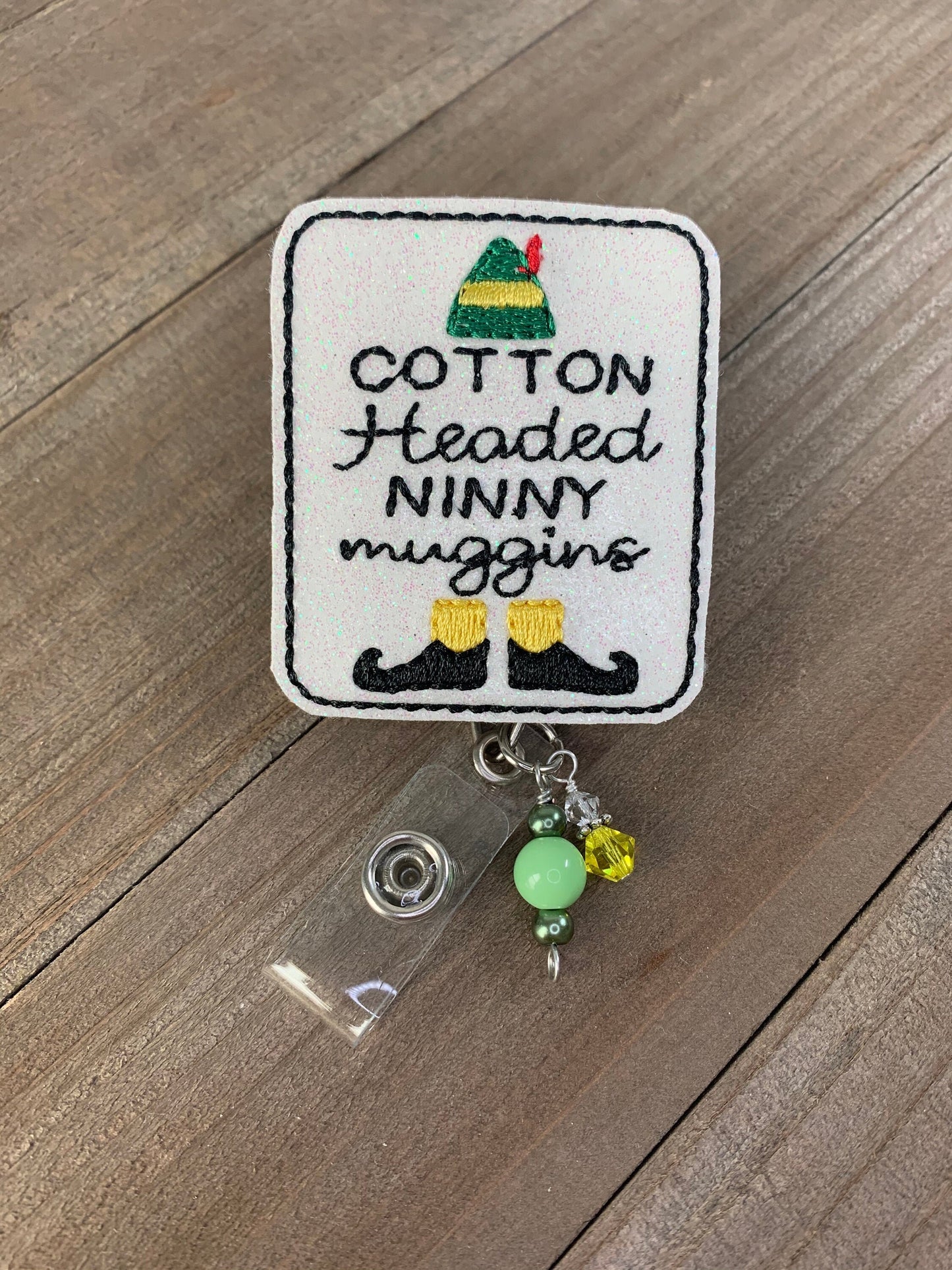 Cotten Headed Ninny Muggins Elf Christmas Movie Badge Reel