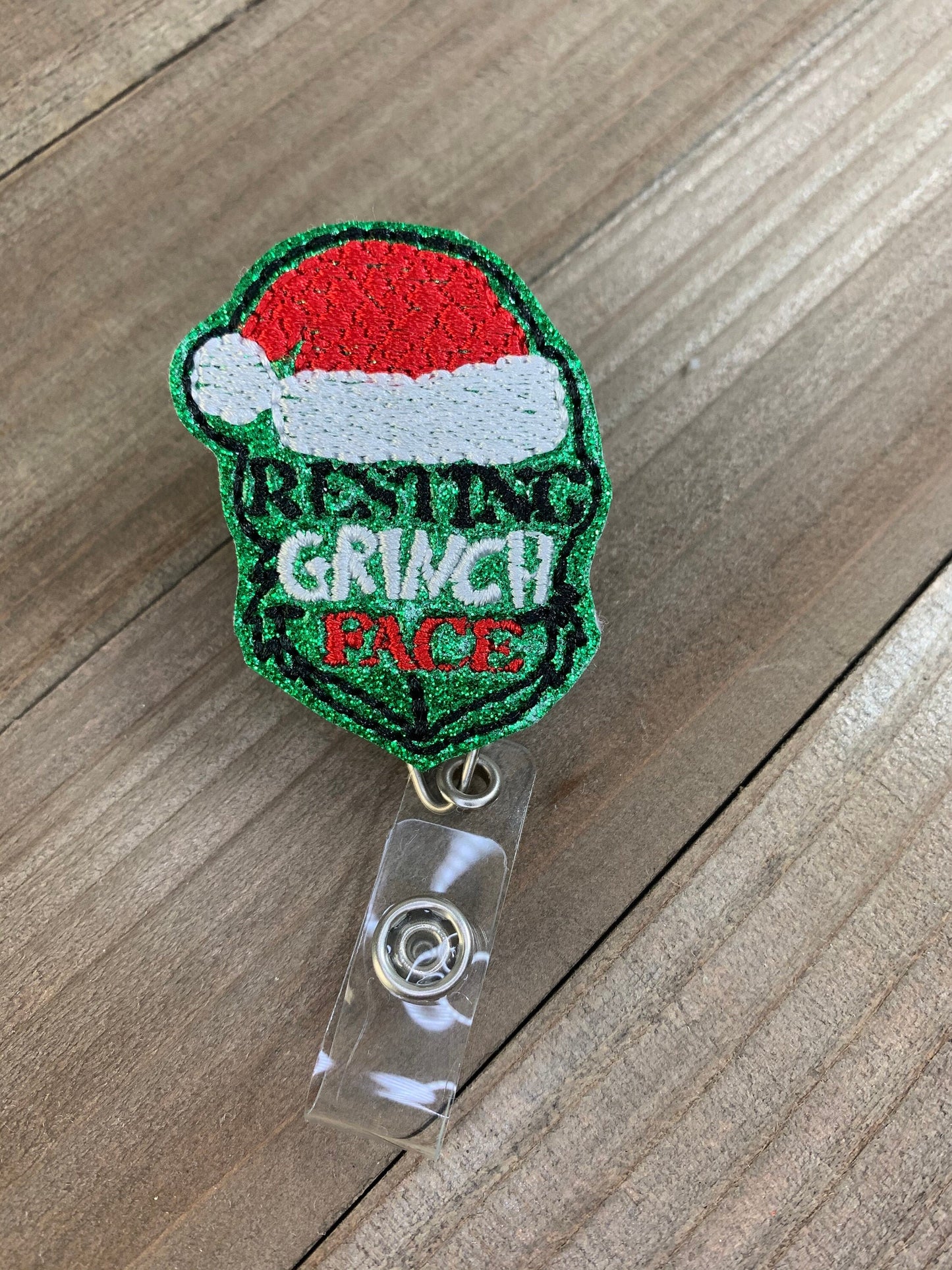 Resting Grinch Face Christmas Badge Reel